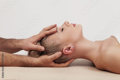 Massage of the head and cervical spine with an osteopath