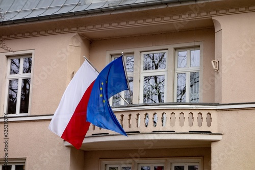 Polish and European Union flags on a building which serves as consulate