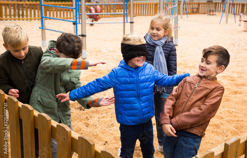 Happy kids playing blind man bluff