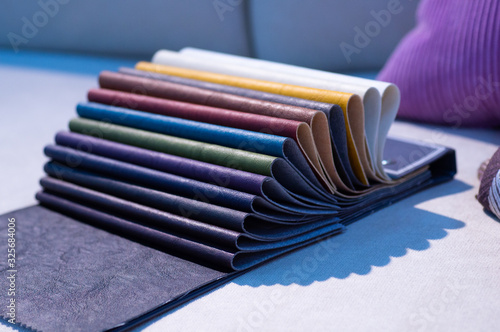 Catalog of multicolored imitation leather. Leatherette samples texture. Industry background