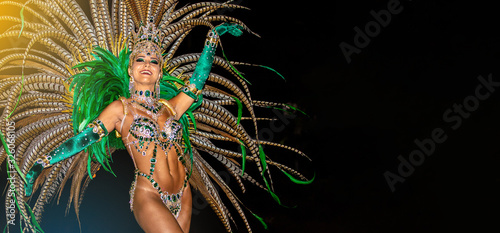 Brazilian wearing Samba Costume. Beautiful Brazilian woman wearing colorful costume and smiling during Carnaval street parade in Brazil.