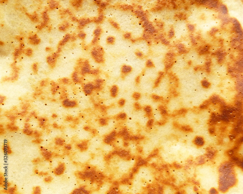 Top view pancake texture background. Pancake surface. Pancake pattern macro view. Tasty sweet dessert texture. Abstract Background. Close-up, shallow depth of field, copy space