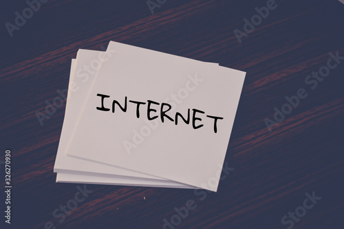 Internet word written on white paper