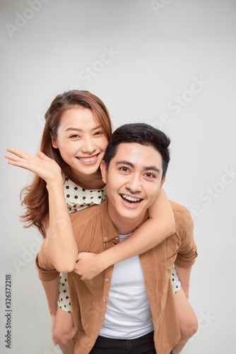 Portrait of young smiling girl hugs her boyfriend