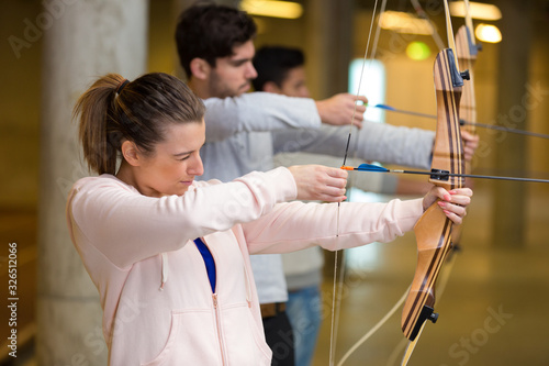 portrait of people during archery cours