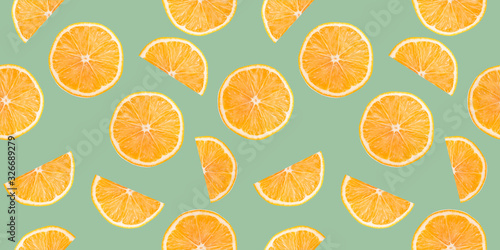 pattern with orange slices on a green background