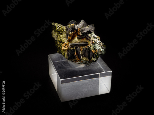 Epidote crystals on black background