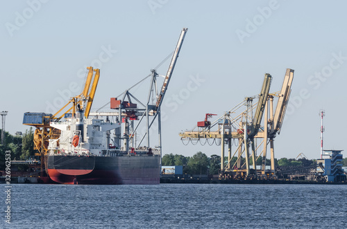 MARITIME TRANSPORT - Freighter at the transhipment terminal in a seaport