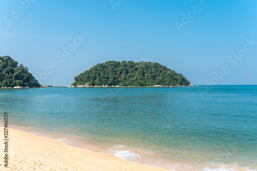 Pangkor island with the beach of the tourist village Teluk Nipah and the small isle of Mentangor in the Malaysian state of Perak at the west coast of the peninsular