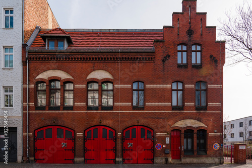 Volunteer fire brigade, an old fire station in Berlin, Oberschoeneweide, Germany, red gates