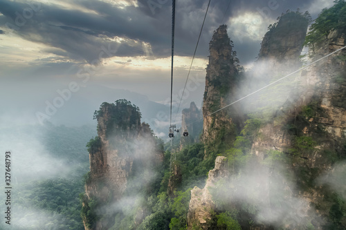 Cable crossing giant pillar mountains in Tianzi Mountain and Yellow Stone Stronghold (Huangshi Zhai), Zhangjiajie National Park, China