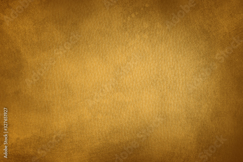 grunge golden leather background or texture with stains