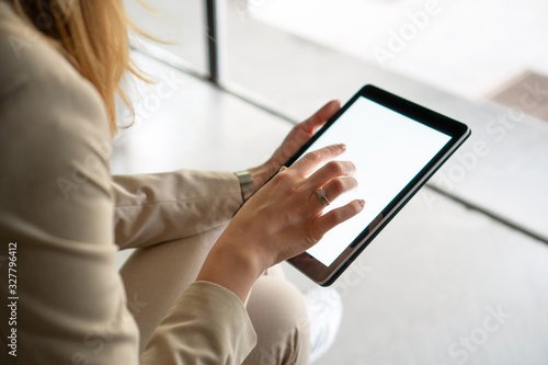 Female hands holding digital tablet 