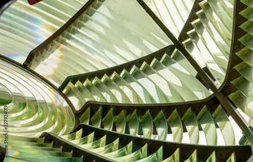 Close image of the glass prisms making up a fresnel lens in a lighthouse