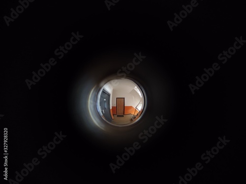 View to the hall through peephole eyelet in the door. Slovakia