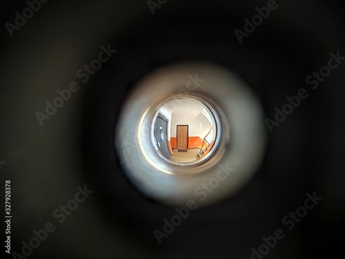 View to the hall through peephole eyelet in the door. Slovakia