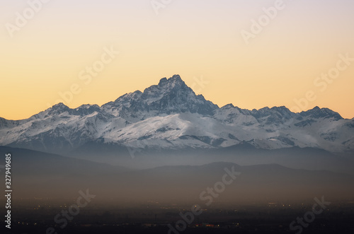 the Mount Viso (Monviso), one of the main peaks of the piedmontese Alps (Italy) seen from the town of Mondovi at sunset