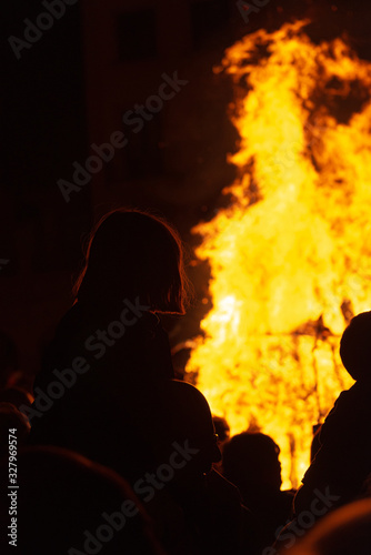 group of people enjoying a bonfire in a festive atmosphere. unrecognizable people. Party and vacation concept. Christianized Celtic party.