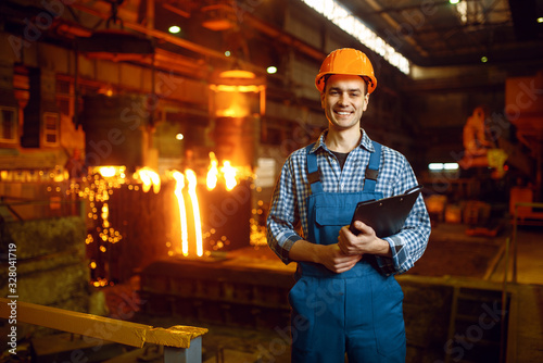 Master at furnace with liquid metal, steel factory