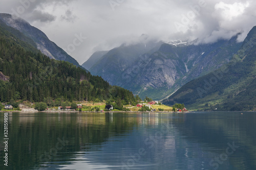 End of fjord. Beautiful Norwegian landscape. view of the fjords. Norway ideal fjord reflection in clear water In cloudy weather. selective focus