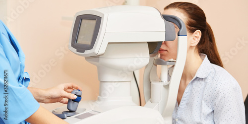 ophthalmologist doctor in exam optician laboratory with female patient. Eye care medical diagnostic. Eyelid treatment