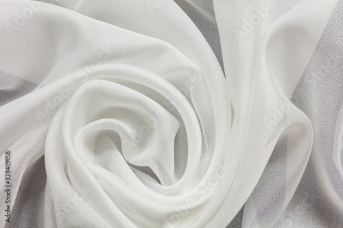 Shiny white cloth background white curly background