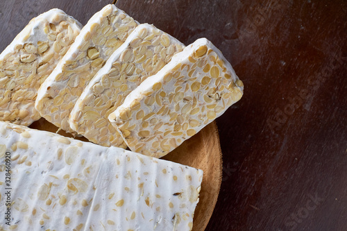 Traditional food of indonesia, Slice of tempeh on the wood background,