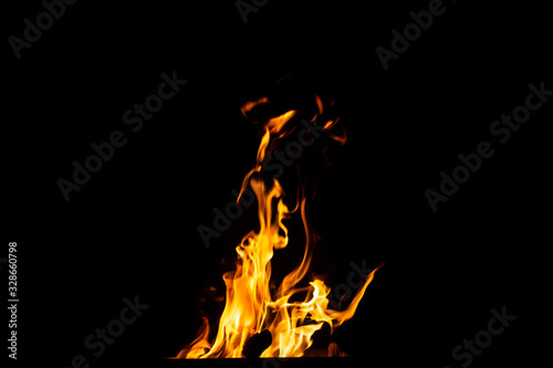 Danger fire on a dark background. Background from fire. Fire pattern can be used in design