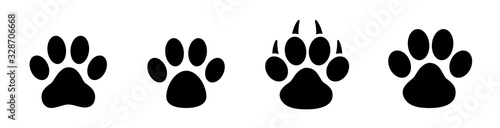 Paw print set. Paw foot trail print of animal. Dog, cat, bear, puppy silhouette. Collection of paw prints. Different animal paw - stock vector.