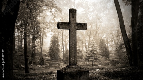 cross in fog at the cemetary