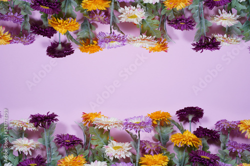 Spring flowers on pink background. Empty space for design.