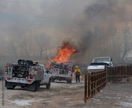 Firefighter Surveys a Wildfire
