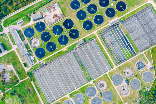 aerial top view of round water settlers for sewage recycling. modern wastewater treatment plant