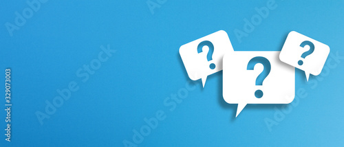 Question marks with speech bubbles on blue background 