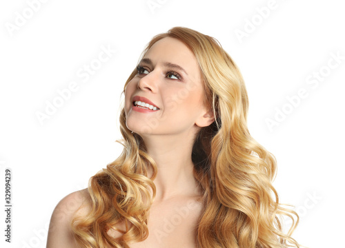 Portrait of beautiful woman with long blonde hair on white background