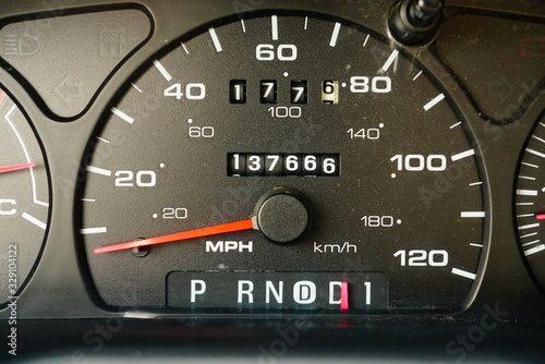 Fuel gauge, vehicle engine temperature, Miles Per Hour Speed indicator, and revolutions per minute indicator on a vehicle dashboard