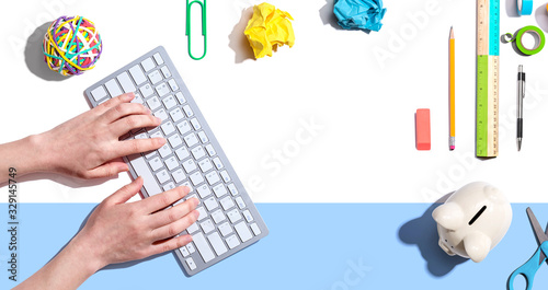 Woman using a computer keyboard - overhead view