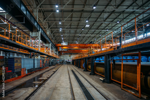 Large hall of warehouse with railroad for freight train load