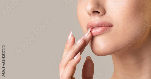 Unrecognizable Girl Touching Lips Over Beige Studio Background, Panorama, Cropped