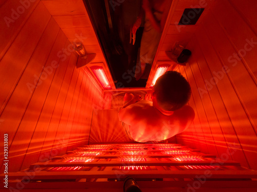 Happy couple relaxing in a luxury infrared sauna