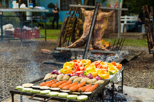 Meat and vegetable exhibition on a barbecue known as Parrilla. Typical barbecue from the south of Latin America.