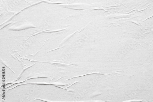 Blank white crumpled and creased paper poster texture background