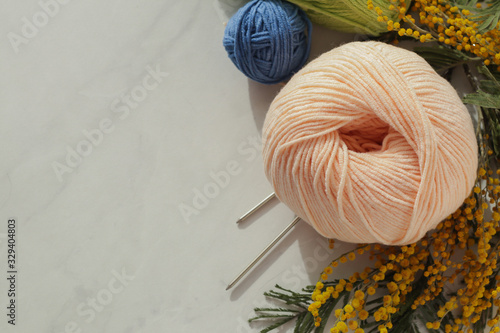 Colorful yarn threads on light background