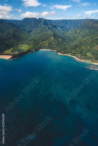 Aerial View of Beautiful Kauai Coast in Hawaii with Blue Water and Coral Reef and Mountains