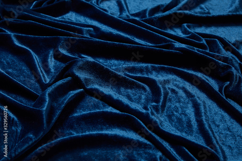 close up view of blue soft and crumpled velour textured cloth