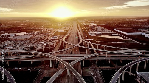 Witness the mesmerizing beauty of a stunning sunset at the intersection of Katy, Texas and the Houston 99 Toll Road Freeway.