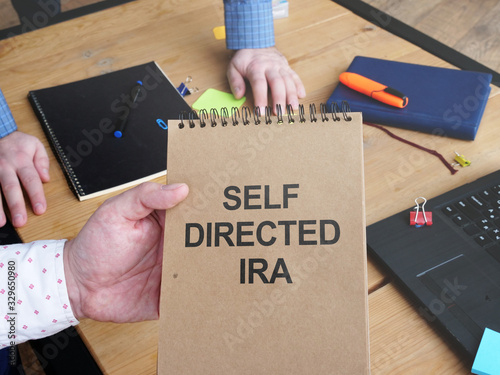 Business photo shows hand written text self directed ira