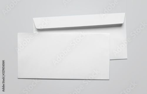 Blank card and white envelope on the desk