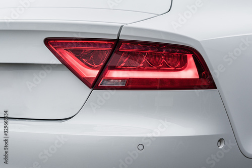 a tail light of a modern white car