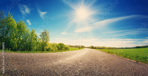 asphalt road panorama in countryside on sunny spring day